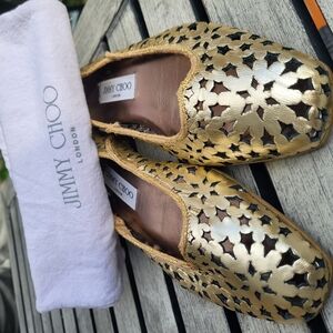 Jimmy Choo Gold Flats with Intricate Cut-Out Design